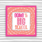 1st day at school card with 'Going to Big School' text on an orange background with spotty pattern, against a striped grey and white background.
