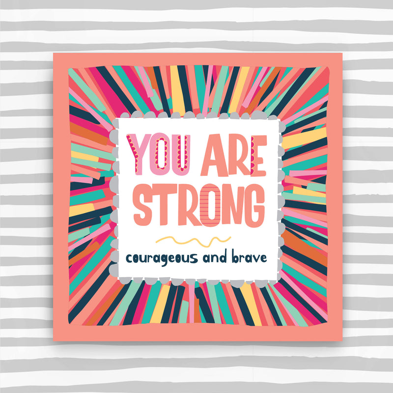 Colorful framed artwork with motivational quote on a striped background