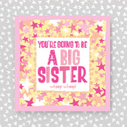 Card with 'You're going to be a big sister' text on a star-patterned background