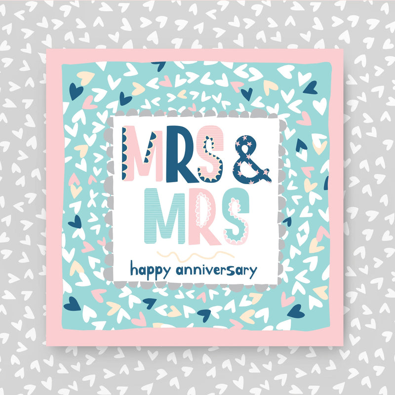 Card with 'Mrs & Mrs happy anniversary'. Perfect for same-sex couples with text on a patterned background.
