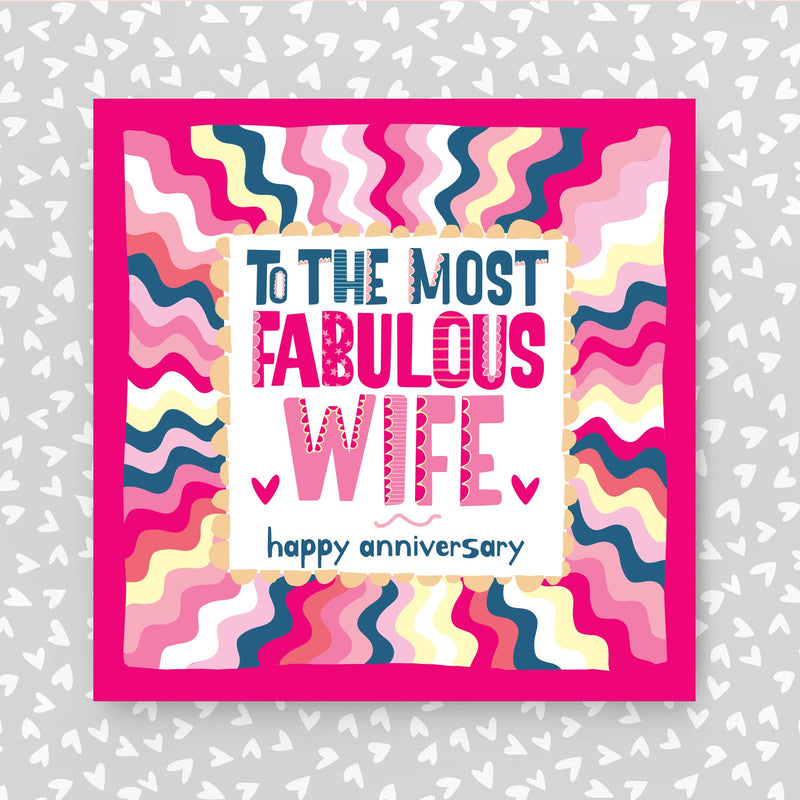 Greeting card with colorful design and text 'To the most fabulous wife, happy anniversary' on a grey background with heart patterns.